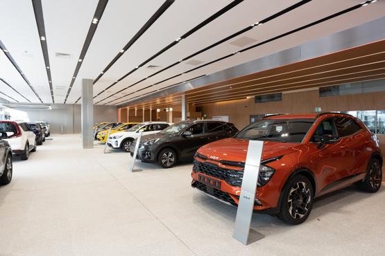 New cars on display at a dealership in Asia amid rising 2026 vehicle prices